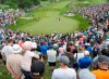 Rory McIlroy of Northern Ireland (right) watches partner Webb Simpson chip on the 18th green moments before winning the 2019 Canadian Open in Ancaster, Ont., on Sunday, June 9, 2019. THE CANADIAN PRESS/Andrew Lahodynskyj