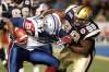 JOHN WOODS / WINNIPEG FREE PRESS Archives
Winnipeg Blue Bombers' Andre Douglas (59) wraps up Montreal Alouettes' Jermaine McElveen (98) in a 2011 game. Douglas, who was considering making a move tot he NFL, has re-signed with the Bombers.