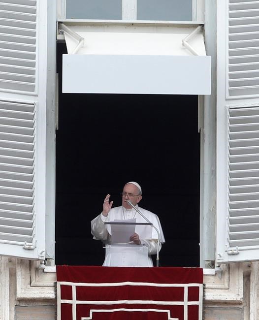 Pope Francis delivers his blessing during the Angelus noon prayer from the window of his studio overlooking St.Peter's Square, at the Vatican, Sunday, March 17, 2019. Francis has offered prayers for