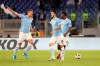 Lazio's Sergej Milinkovic-Savic, left, celebrates after scoring his side's first goal during the Europa League Group E soccer match between Lazio and Rennes, at Rome's Olympic Stadium, Thursday, Oct. 3, 2019. (AP Photo/Alessandra Tarantino)