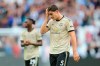 Manchester United's Harry Maguire touches his forehead as he leaves at the end of the English Premier League soccer match between West Ham and Manchester United at London stadium in London, Sunday, Sept. 22, 2019. West Ham beat Manchester United 2-0. (AP Photo/Leila Coker)