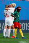 England players celebrate at the end of the Women's World Cup round of 16 soccer match between England and Cameroon at the Stade du Hainaut stadium in Valenciennes, France, Sunday, June 23, 2019. England beat Cameroon 3-0. (AP Photo/Michel Spingler)