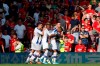Crystal Palace's Patrick van Aanholt, right, celebrates with teammates after scoring his side's second goal during the English Premier League soccer match between Manchester United and Crystal Palace at Old Trafford in Manchester, England Saturday, Aug, 24, 2019. (AP Photo/Alastair Grant)