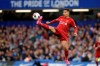 Liverpool's Roberto Firmino reaches for the ball during the British premier League soccer match between Chelsea and Liverpool, at the Stamford Bridge Stadium, London, Sunday, Sept. 22, 2019. (AP Photo/Matt Dunham)