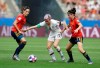 United States'Megan Rapinoe, middle, is challenged by Spain's Vicky Losada, left, and her teammate Lucia Garcia during the Women's World Cup round of 16 soccer match between Spain and US at the Stade Auguste-Delaune in Reims, France, Monday, June 24, 2019. (AP Photo/Alessandra Tarantino)