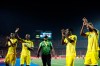 FILE - In this Wednesday, June 26, 2019 file photo, Zimbabwe players applaud their fans after the group A soccer match between Uganda and Zimbabwe at the Africa Cup of Nations at Cairo International Stadium in Cairo, Egypt. Zimbabwe's government-run sports commission says it has asked FIFA to remove officials in charge of the country's soccer federation from office and appoint a temporary committee. The Sports and Recreation Commission regulates sport in Zimbabwe and says it wants the Zimbabwe Football Association to be run by a normalization committee. (AP Photo/Ariel Schalit, File)