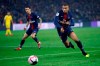 FILE - In this Saturday, Dec. 22, 2018 file photo, Paris St Germain's Kylian Mbappe runs for the ball during the League One soccer match between Paris Saint Germain and Nantes at the Parc des Princes stadium in Paris. French media are joining in support of L'Equipe after the newspaper said its reporters had been banned from recent Paris Saint-Germain news conferences. According to L'Equipe, PSG banned its journalists after the newspaper published a story this month hinting the club would be forced to sell star forward Neymar or Kylian Mbappe because of financial fair play rules. (AP Photo/Francois Mori, File