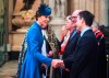 Britain's Kate, the Duchess of Cambridge, left, shakes hands with unidentified guests druing the Anzac Day Service of Commemoration and Thanksgiving at Westminster Abbey, in London, Thursday April 25, 2019. Anzac Day has been commemorated in London since the first anniversary of the Anzac landings at Gallipoli in 1916, when King George V attended a service at Westminster Abbey and more than 2,000 Australian and New Zealand troops marched through the streets. (Victoria Jones/Pool Photo via AP)