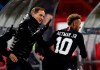 FILE - In this Tuesday, Dec. 11, 2018 file photo, PSG coach Thomas Tuchel, left, congratulates PSG forward Neymar after he scored his side' second goal during the Champions League group C soccer match between Red Star and Paris Saint Germain, in Belgrade, Serbia. PSG travels to face Manchester United on Feb. 12, 2019 without the Brazil forward, who faces around 10 weeks out. With Neymar so influential to the way PSG plays, it means coach Thomas Tuchel must have a tactical re-think. (AP Photo/Darko Vojinovic, File)