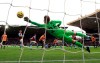 Wolverhampton Wanderers' Ruben Neves, background centre, scores his side's first goal of the game, during the English Premier League soccer match between Wolverhampton Wanderers and Aston Villa, at Molineux, in Wolverhampton, England, Sunday, Nov. 10, 2019. (Nick Potts/PA via AP)