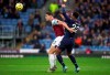 Burnley's James Tarkowski, left and West Ham United's Sebastien Haller battle for the ball during the English Premier League soccer match between Burnley and West Ham United, at Turf Moor, in Burnley, England, Saturday, Nov. 9, 2019. (Ian Hodgson/PA via AP)
