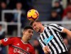 Newcastle United's Paul Dummett, right, and Fulham's Aleksandar Mitrovic battle for the ball, during the English Premier League soccer match between Newcastle United and Fulham, at St James' Park, in Newcastle, England, Saturday Dec. 22, 2018. (Owen Humphreys/PA via AP)