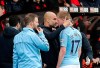Manchester City manager Pep Guardiola consoles injured player Kevin De Bruyne as he leaves the pitch during the English Premier League soccer match between Bournemouth and Manchester City, at the Vitality Stadium, in Bournemouth, England, Saturday March 2, 2019. (Adam Davy/PA via AP)