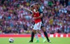 Arsenal's Dani Ceballos, left and Burnley's Erik Pieters battle for the ball, during the English Premier League soccer match between Arsenal and Burnley FC, at The Emirates Stadium, in London, Saturday, Aug. 17, 2019. (Yui Mok/PA via AP)