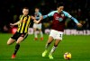 Watford's Tom Cleverley, left and Burnley's Dwight McNeil battle for the ball, during the English Premier League soccer match between Watford and Burnley, at Vicarage Road, in Watford, England, Saturday, Jan. 19, 2019. (Jonathan Brady/PA via AP)