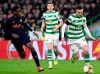 Valencia's Geoffrey Kondogbia left, view for the ball with Celtic's Callum McGregor during the Europa League round of 32, first leg soccer match between Celtic and Valencia, at Celtic Park, in Glasgow, Scotland, Thursday, Feb. 14, 2019. (Ian Rutherford/PA via AP)