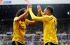 Arsenal's Pierre-Emerick Aubameyang, right, celebrates scoring his side's first goal of the game with team mate Matteo Guendouzi, during the English Premier League soccer match between Newcastle United and Arsenal, at St James' Park, in Newcastle, England, Sunday, Aug. 11, 2019. (Owen Humphreys/PA via AP)