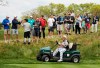 FILE - In this May 17, 2019 file photo, John Daly drives his cart off the 16th tee during the second round of the PGA Championship golf tournament, at Bethpage Black in Farmingdale, N.Y. Organizers of the British Open have refused a request by former champion John Daly to use a golf cart at the championship in Royal Portrush this month. Daly had applied to use a cart because of his arthritic right knee. The R&A said it was declining the request because “walking the course is an integral part of the championship and is central to the tradition of links golf.” It said it was important to “ensure that, as far as possible, the challenge is the same for all players in the field.” (AP Photo/Andres Kudacki, FIle)