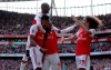 Arsenal's Pierre-Emerick Aubameyang, left, celebrates scoring his side's first goal of the game with teammates, during the English Premier League soccer match between Arsenal and Burnley FC, at The Emirates Stadium, in London, Saturday, Aug. 17, 2019. (Yui Mok/PA via AP)