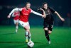 Arsenal's Louise Quinn, left and Slavia Praha's Laura Zemberyova vie for the ball, during the Women's Champions League round of 16 second leg soccer match between Arsenal and Slavia Praha, at Meadow Park, in Borehamwood, England, Thursday, Oct. 31, 2019. (Tess Derry/PA via AP)