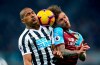 Newcastle United's Salomon Rondon, left and Burnley's Jeff Hendrick battle for the ball in the air, during the English Premier League soccer match between Newcastle and Burnley, at St James' Park, in Newcastle, England, Tuesday, Feb. 26, 2019. (Owen Humphreys/PA via AP)