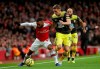 Arsenal's Alexandre Lacazette, left and Southampton's Jan Bednarek battle for the ball during the English Premier League soccer match between Arsenal and Southhampton, at the Emirates Stadium, in London, Saturday, Nov. 23, 2019. (Yui Mok/PA via AP)