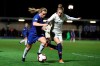 Chelsea Women's Erin Cuthbert, left, vies for the ball with Paris Saint-Germain Women's Emma Berglund, during the Women's Champions League quarter final first leg soccer match between Chelsea and Paris Saint-Germain, at the Cherry Red Records Stadium, in London, Thursday March 21, 2019. (Bradley Collyer/PA via AP)