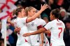 England's Ellen White, left, celebrates scoring her side's first goal with teammates, during the Women's International Friendly soccer match between England and Germany, at Wembley Stadium, in London, Saturday, Nov. 9, 2019. (John Walton/PA via AP)