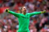 Liverpool goalkeeper Adrian celebrates Sadio Mane's first goal of the game, during the English Premier League soccer match between Southampton and Liverpool, at St Mary's, in Southampton, England, Saturday, Aug. 17, 2019. (Steven Paston/PA via AP)