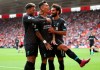 Liverpool's Roberto Firmino, centre, celebrates scoring his side's second goal of the game with teammates, during the English Premier League soccer match between Everton and Watford, at Goodison Park, in Liverpool, England, Saturday, Aug. 17, 2019. (Ian Hodgson/PA via AP)