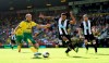 Norwich City's Teemu Pukki, left, has a shot on goal during the English Premier League soccer match between Norwich City and Newcastle United, at Carrow Road, in Norwich, England, Saturday, Aug.17, 2019. (Joe Giddens/PA via AP)