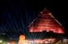 Lights illuminates the sky over the historical site of the Giza Pyramids and Sphinx to celebrate the African Cup of Nations draw in Cairo, Egypt, Friday, April 12, 2019. The tournament which will feature 24 teams will be held in Egypt in June 2019. (AP Photo/Amr Nabil)