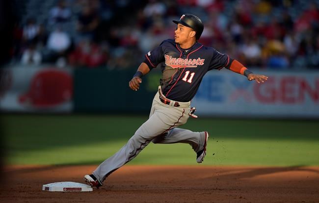 Minnesota Twins' Jorge Polanco rounds second on a single by Willians Astudillo during the first inning of a baseball game against the Los Angeles Angels, Monday, May 20, 2019, in Anaheim, Calif. (AP Photo/Mark J. Terrill)