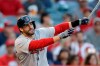 Boston Red Sox's J.D. Martinez watches his RBI-double against the Los Angeles Angels during the first inning of a baseball game in Anaheim, Calif., Saturday, Aug. 31, 2019. (AP Photo/Chris Carlson)