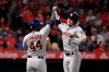 Houston Astros' Alex Bregman, right, is congratulated by Yordan Alvarez after hitting a solo home run during the second inning of a baseball game against the Los Angeles Angels, Friday, Sept. 27, 2019, in Anaheim, Calif. (AP Photo/Mark J. Terrill)