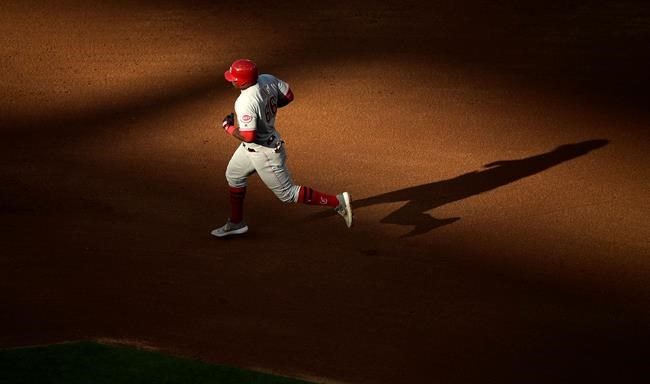 Cincinnati Reds' Yasiel Puig rounds second after hitting a solo home run during the fifth inning of a baseball game against the Los Angeles Angels Wednesday, June 26, 2019, in Anaheim, Calif. (AP Photo/Mark J. Terrill)