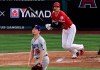Los Angeles Angels' Shohei Ohtani watches his home run off Los Angeles Dodgers starting pitcher Kenta Maeda, foreground, during the first inning of a baseball game Tuesday, June 11, 2019, in Anaheim, Calif. (AP Photo/Mark J. Terrill)