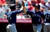 Seattle Mariners' Tom Murphy, right, is congratulated by Kyle Seager after hitting a two-run home run during the second inning of a baseball game against the Los Angeles Angels, Sunday, June 9, 2019, in Anaheim, Calif. (AP Photo/Mark J. Terrill)