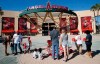 Los Angeles Angel mourners stand at a memorial to give their condolences for pitcher Tyler Skaggs at Angel Stadium in Anaheim, Calif., Monday, July 1, 2019. Skaggs died at the age of 27, stunning Major League Baseball and leading to the postponement of the team's game against the Texas Rangers on Monday. (AP Photo/Alex Gallardo)