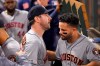 Houston Astros' Justin Verlander, left, is congratulated by Jose Altuve in the dugout after striking out Los Angeles Angels' Kole Calhoun for his 3,000th career strikeout during the fourth inning of a baseball game Saturday, Sept. 28, 2019, in Anaheim, Calif. (AP Photo/Mark J. Terrill)
