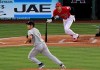 Los Angeles Angels' Shohei Ohtani, right, runs to first for a single as Seattle Mariners starting pitcher Yusei Kikuchi runs to back up the first baseman during the first inning of a baseball game Saturday, June 8, 2019, in Anaheim, Calif. (AP Photo/Mark J. Terrill)