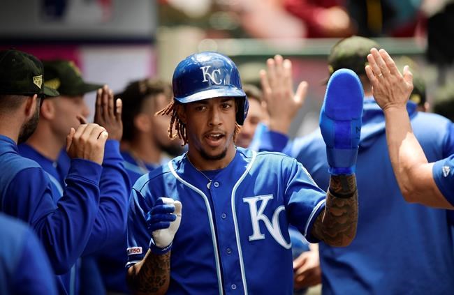 Kansas City Royals' Adalberto Mondesi is congratulated by teammates after scoring on a double by Kansas City Royals' Hunter Dozier during the third inning of a baseball game against the Los Angeles Angels Sunday, May 19, 2019, in Anaheim, Calif. (AP Photo/Mark J. Terrill)