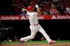 Los Angeles Angels' Albert Pujols follows through on an RBI single during the third inning of the team's baseball game against the Seattle Mariners, Thursday, April 18, 2019, in Anaheim, Calif. (AP Photo/Jae C. Hong)