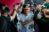 Oakland Athletics' Matt Olson (28) is congratulated in the dugout for his three-run home run during the third inning of the team's baseball game against the Los Angeles Angels on Friday, June 28, 2019, in Anaheim, Calif. (AP Photo/Marcio Jose Sanchez)