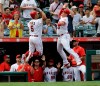 Los Angeles Angels designated hitter Albert Pujols, left, celebrates with Justin Bour, right, after hitting a three-run home run against the Tampa Bay Rays during the fifth inning of a baseball game in Anaheim, Calif., Sunday, Sept. 15, 2019. (AP Photo/Alex Gallardo)