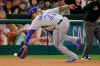 Toronto Blue Jays third baseman Vladimir Guerrero Jr. fields a ball hit by Los Angeles Angels' David Fletcher during the seventh inning of a baseball game in Anaheim, Calif., Wednesday, May 1, 2019. Fletcher was out at first. (AP Photo/Chris Carlson)