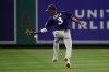 Milwaukee Brewers' Orlando Arcia misses a single hit by Los Angeles Angels' David Fletcher during the eighth inning of a baseball game Wednesday, April 10, 2019, in Anaheim, Calif. (AP Photo/Jae C. Hong)