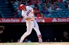 Los Angeles Angels' Mike Trout hits a two-run home run during the sixth inning against the Texas Rangers in a baseball game Sunday, April 7, 2019, in Anaheim, Calif. (AP Photo/Michael Owen Baker)