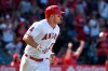 Los Angeles Angels' Mike Trout watches his two-run home run during the sixth inning against the Texas Rangers in a baseball game Sunday, April 7, 2019, in Anaheim, Calif. (AP Photo/Michael Owen Baker)