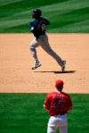 Seattle Mariners' Edwin Encarnacion, top, heads to third after hitting a solo home run as Los Angeles Angels relief pitcher Cody Allen watches during the sixth inning of a baseball game Sunday, June 9, 2019, in Anaheim, Calif. (AP Photo/Mark J. Terrill)